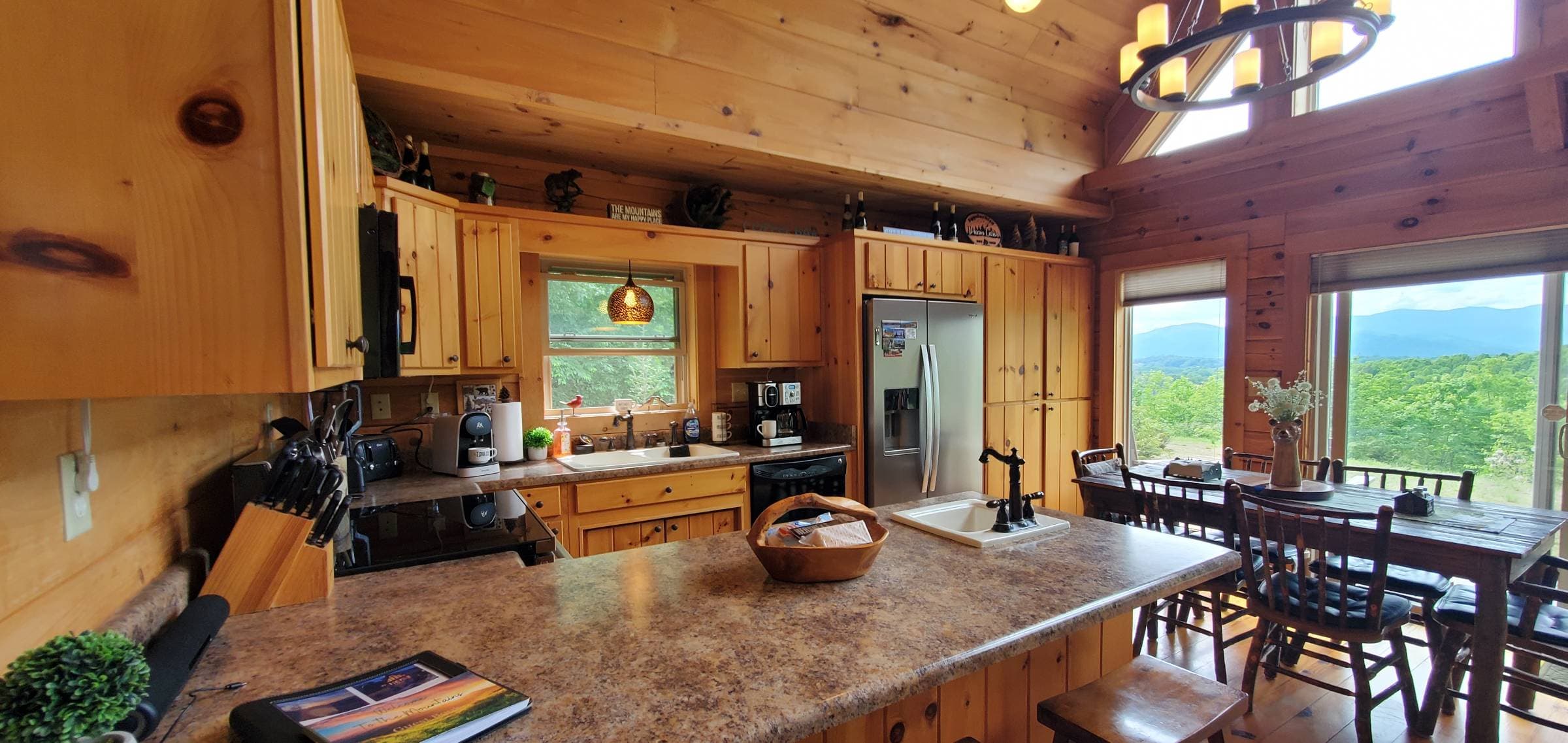 luxe full kitchen surrounded by great wall of windows new appliances.